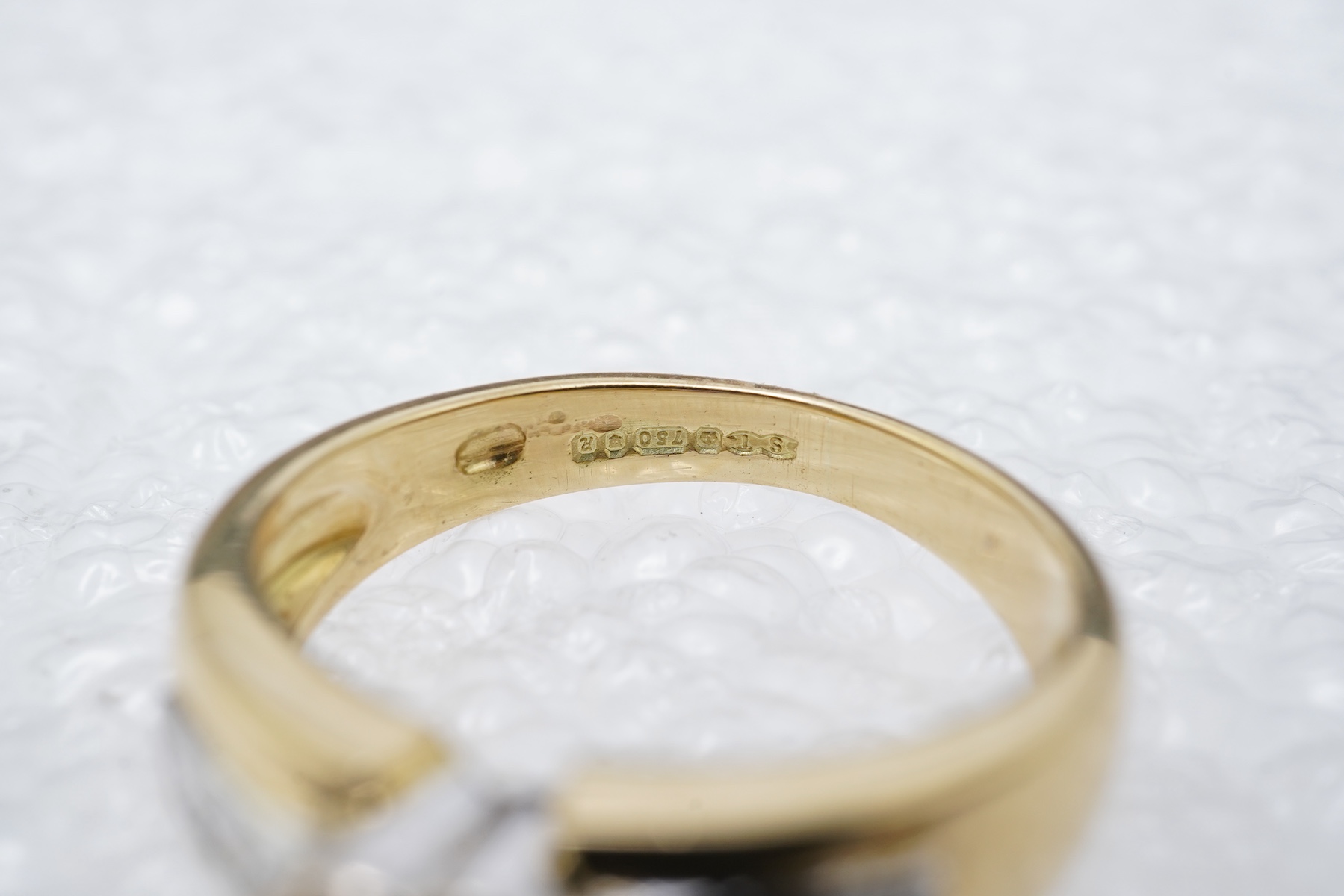 A pink sapphire and diamond ring